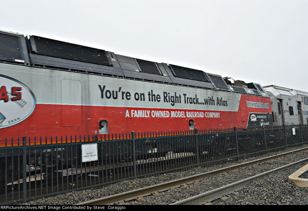 Atlas Company Slogan and 100th anniversary website at rear of the long hood. 